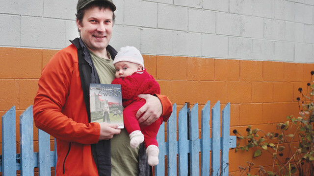 Local fantasy author Walter Rhein, his new novel, The Bone Sword, and his new human being, Sofia. 