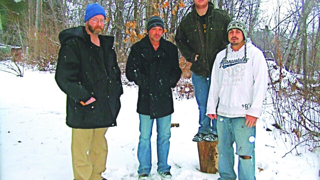 THE LOG ACTUALLY PLAYS TAMBURINE. Experienced hard rock band Reason One – Todd Hanson, Howie T., Logan Tremblay, and Mike Miller – now has local ties.