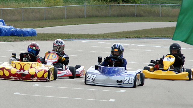ABOVE: THE DANGER ZONE. Eau Claire’s very own go-kart raceway, located on the same turf as the Menards Distribution Center, is the nearest race track of its kind in the area.