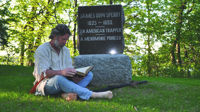 James Dow Sperry – portrayed by local actor Pat Thibaldo – reads next to his own gravestone in Menomonie’s Evergreen Cemetery. Fun fact: Though Sperry’s headstone is there, his body actually isn’t.
