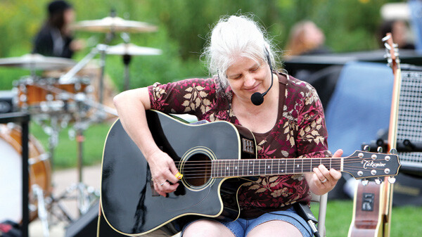 For her new solo EP, singer-songwriter Nancy Dawn Olson tapped a number of local music veterans. Above: Olson performs a pre-show set at the Sounds Like Summer Concert series on August 15.