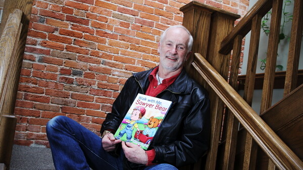 ANOTHER BOOK BY THE WALL. Writer Richard Tepler’s new kids’ book is called Walk With Me, Sawyer Bear.