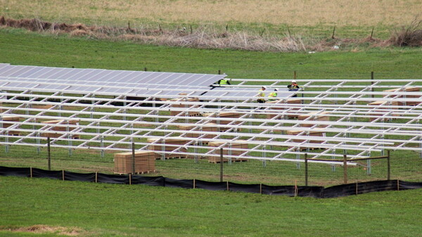 A NEW CROP OF ENERGY. Workers installed panels last month at the Vernon Electric Cooperative’s “community solar farm” near Westby. The Eau Claire Energy Cooperative is pursuing a similar solar project that would involve 5 acres of solar panels at a site between Fall Creek and Eau Claire.