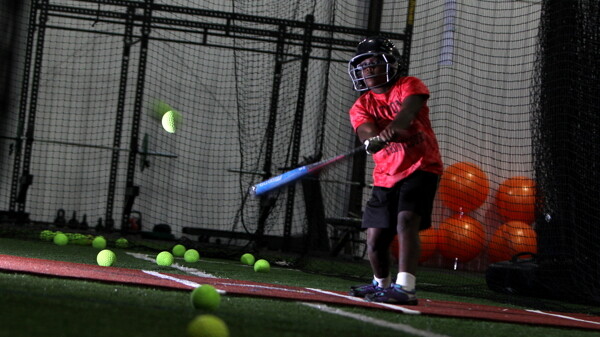 SWING BATTER, BATTER, SWING! The Eau Claire Sports Warehouse, 2983 11th St., offers indoor space to practice softball, volleyball, basketball, and many other sports.