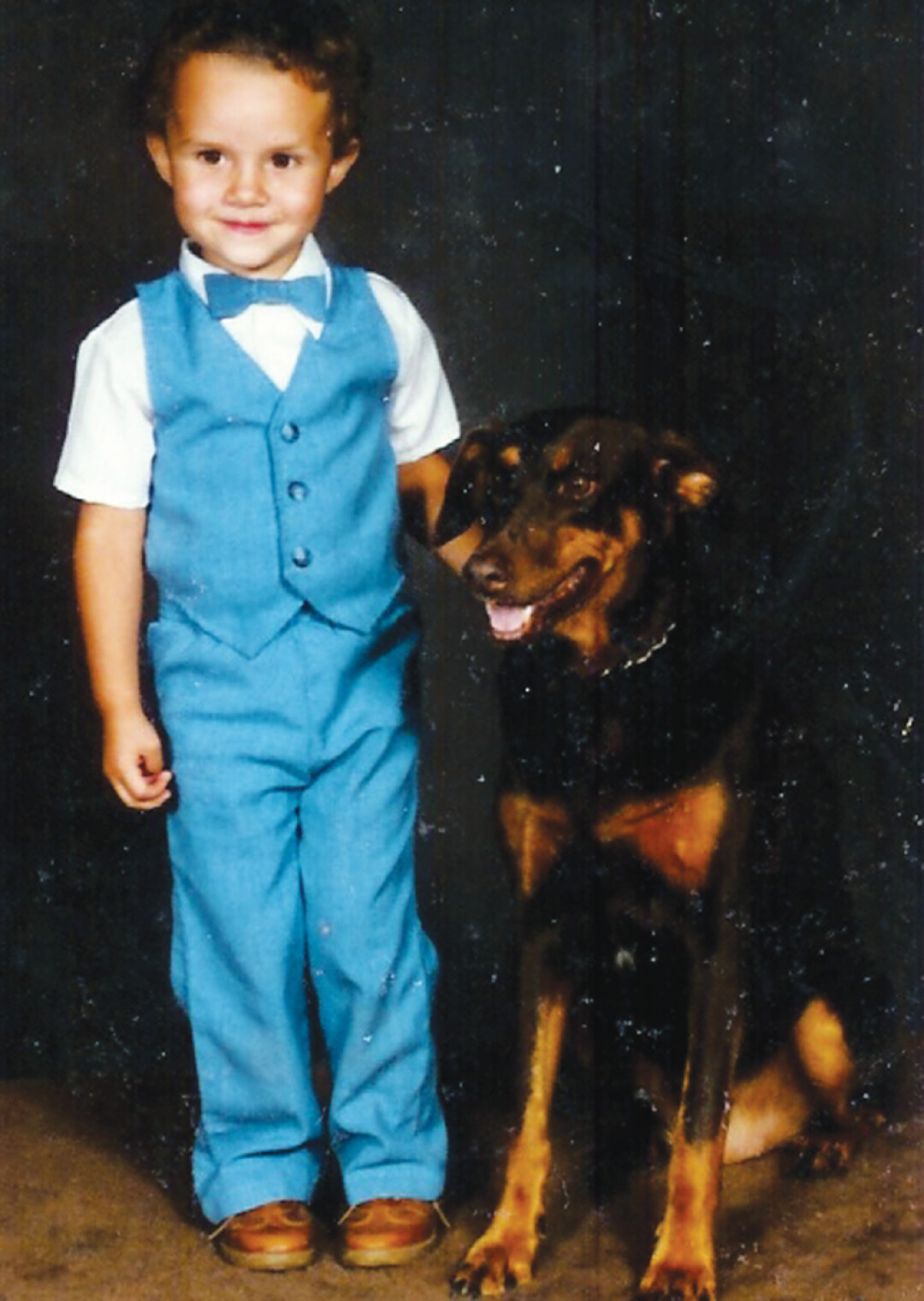 WHAT THE HECK, SANDY? I THOUGHT WE WERE BOTH GONNA DO THE BOWTIE THING! A young B.J. Hollars with his childhood dog, Sandy. In the book, Hollars details a cross-country trip to give Sandy a final resting place.