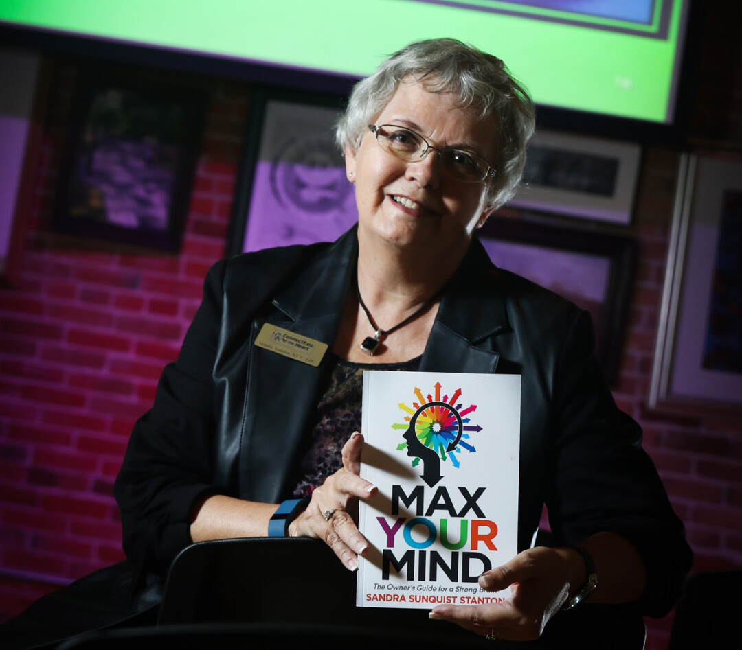 CONCERNED WITH THE CRANIUM. Local author and brain coach Sandra Stanton shows off her new book.