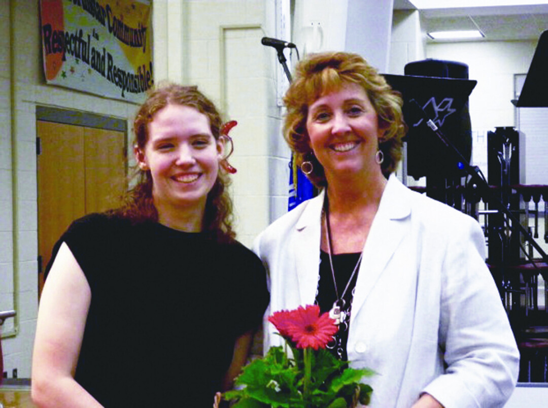 Retiring Northstar Middle School band director Laurie Francis (right) and former student Kim Osberg. Francis commissioned Osberg to compose music for the director’s final concert, capping off her 21-year career.