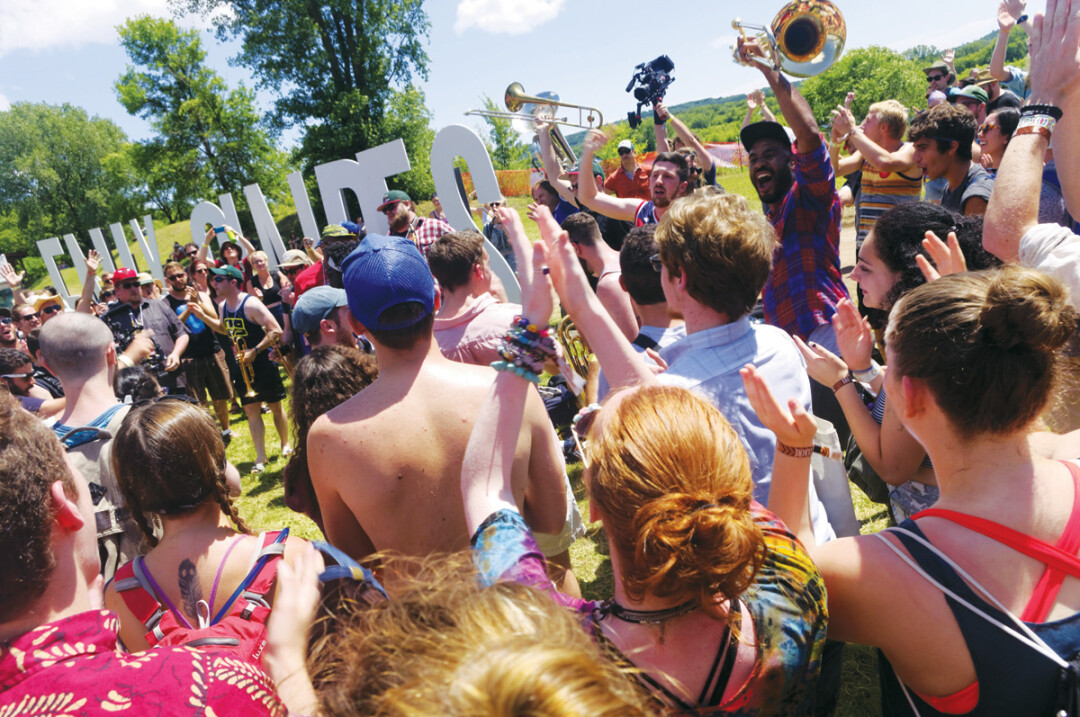 Fans got into the spirit with the no bs! brass band as the band paraded around the grounds at last year’s eaux claires music and arts festival.