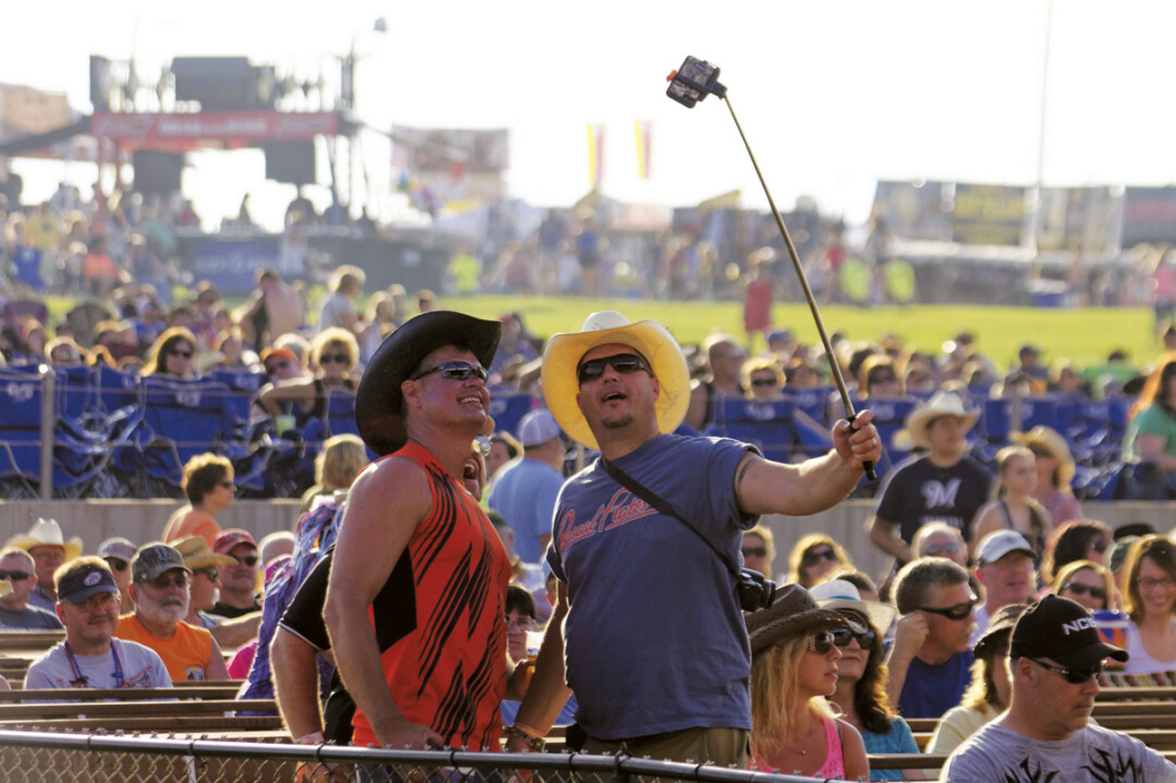  A couple of country fans couldn’t resist a selfie at Country Fest last year.