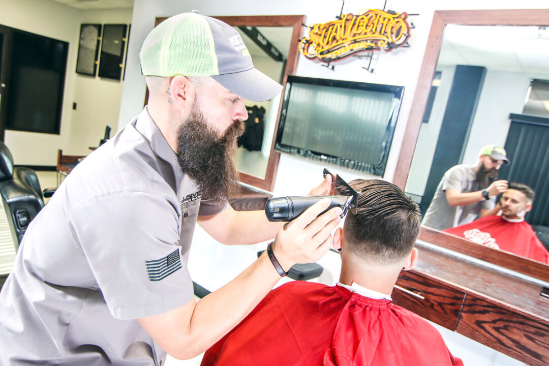 A LITTLE OFF THE TOP. Without advertising or an online presence, Dustin Price has built a loyal clientele for Exclusive Barbershop primarily through word of mouth.