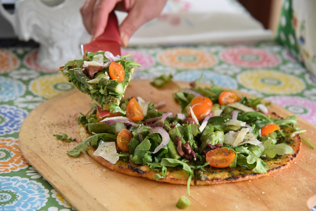 Inga’s Socca flatbread topped with farm veggies.