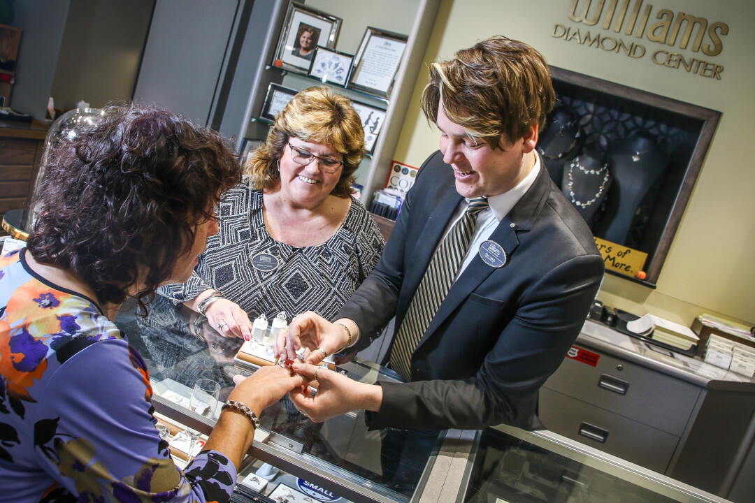 SERVICE WITH SPARKLE. Williams Diamond Center owner Denise Wurtzel (above with designer Teva Dekel) has held a passion for jewelry for 37 years.
