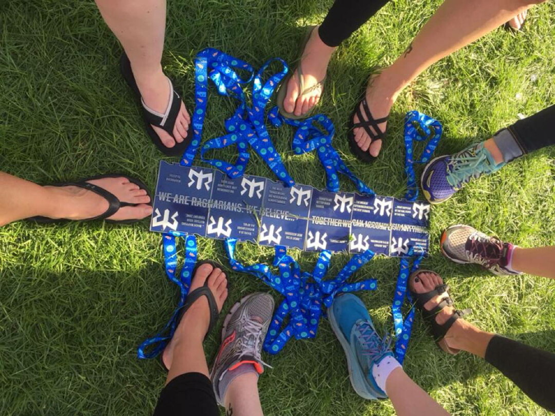 Members of Team Heart and Sole pose with their medals. Ragnar medals fit together like puzzle pieces to spell a message. This year’s message: “We are Ragnarians. Together, we can accomplish anything.”