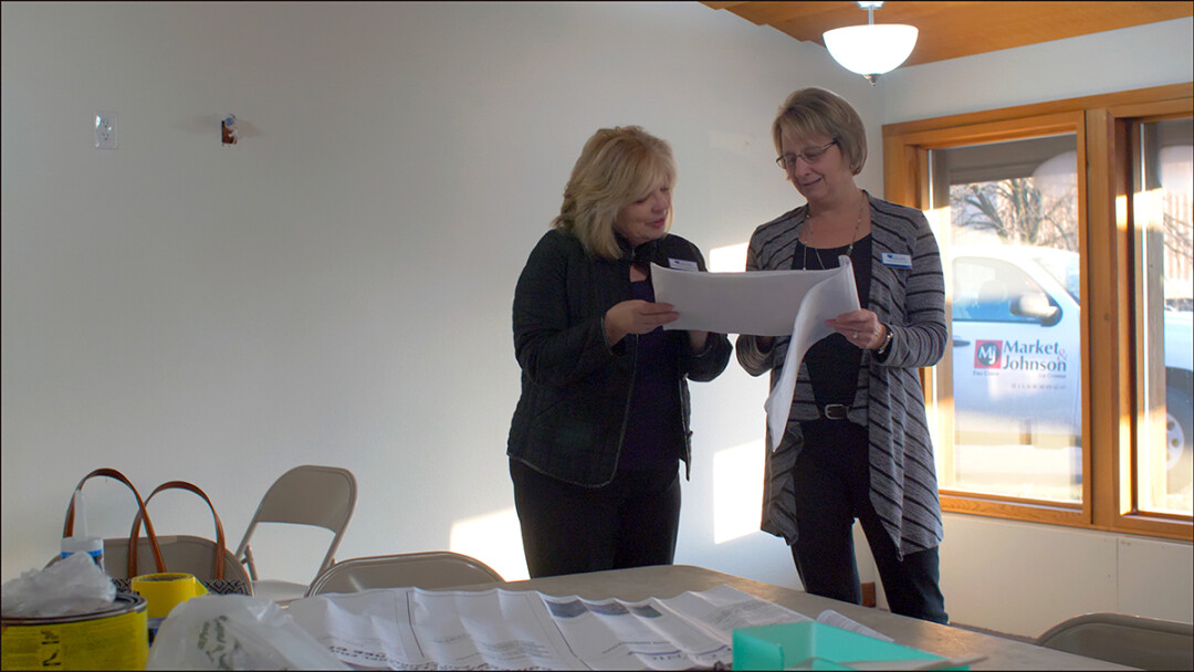 Chippewa Valley Free Clinic Executive Director Maribeth Woodford, left, and Medical Director Dr. Lori Whitis examine plans for the clinic’s new space.