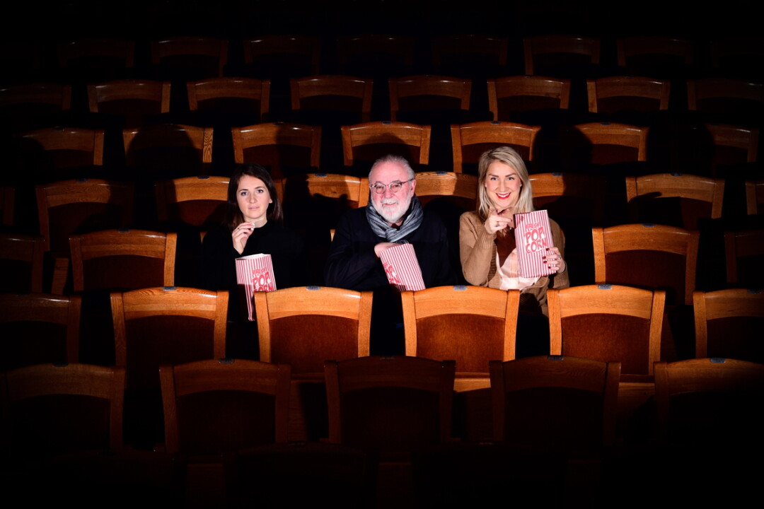 VIEWING PARTY. Red Cedar Film Festival organizers (left to right) Rebecca Thacker, Peter Galante, and Anna McCabe sit in Mabel Tainter Center for the Arts, one of two historic locations where the forthcoming festival will be held. More entries will be screened just across the street in UW-Stout’s Harvey Hall.
