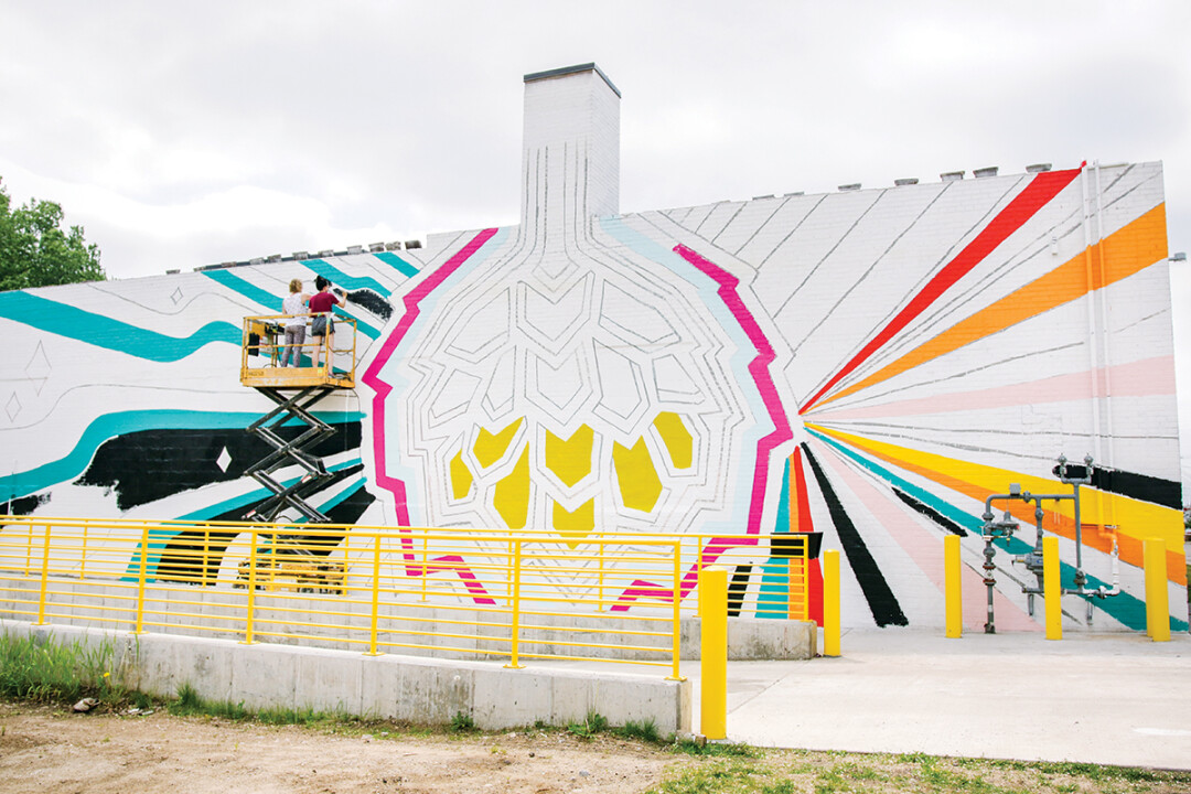 ALL HOPPED UP ON BIG ART. The Brewing Projekt’s recently opened new brewery and event venue at 1807 N. Oxford Ave. now features a colorful mural by artist Dez Lezotte.