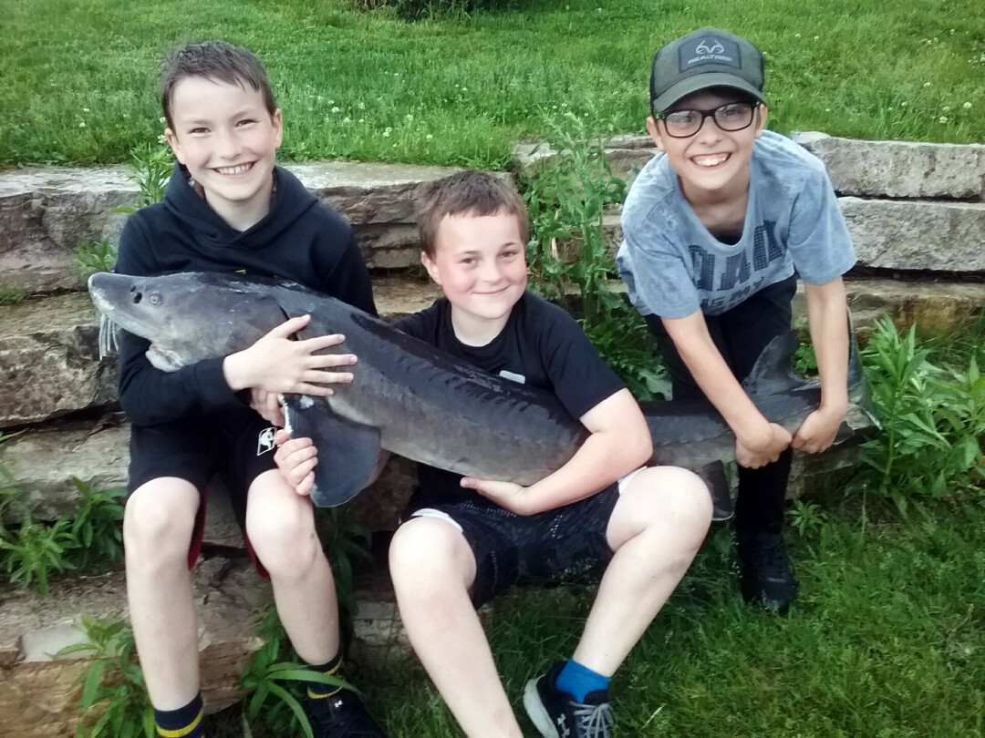 WHAT A CATCH! 10-year-old Christian Severud (middle) reeled in a once-in-a-