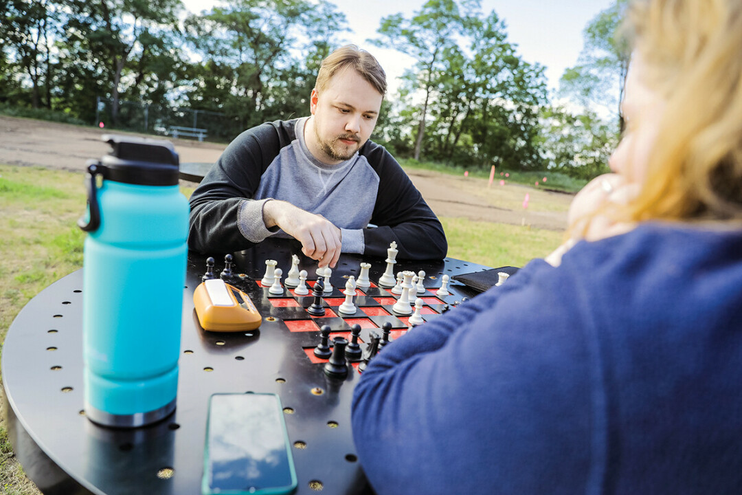 THE KING'S GAMBIT. New game tables in Eau Claire parks, including this one at McDonough Park, are designed for chess or checkers. (Bring your own pieces, players.)