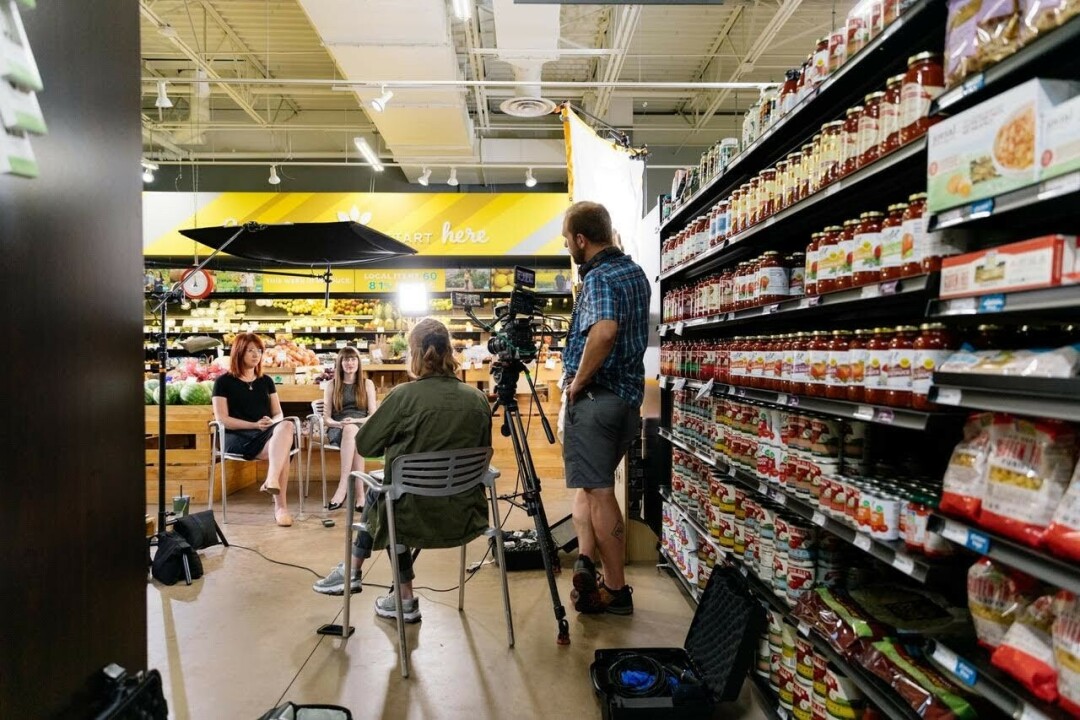 BEHIND THE SCENES. This photo, from summer 2020, was captured by photographer and videographer Kyle Lehman, as the Volume One crew interviewed Becca Schoenborn (right) and Kendall Williams (left) at the Menomonie Market Food Co-Op about how they had been impacted by COVID-19. 