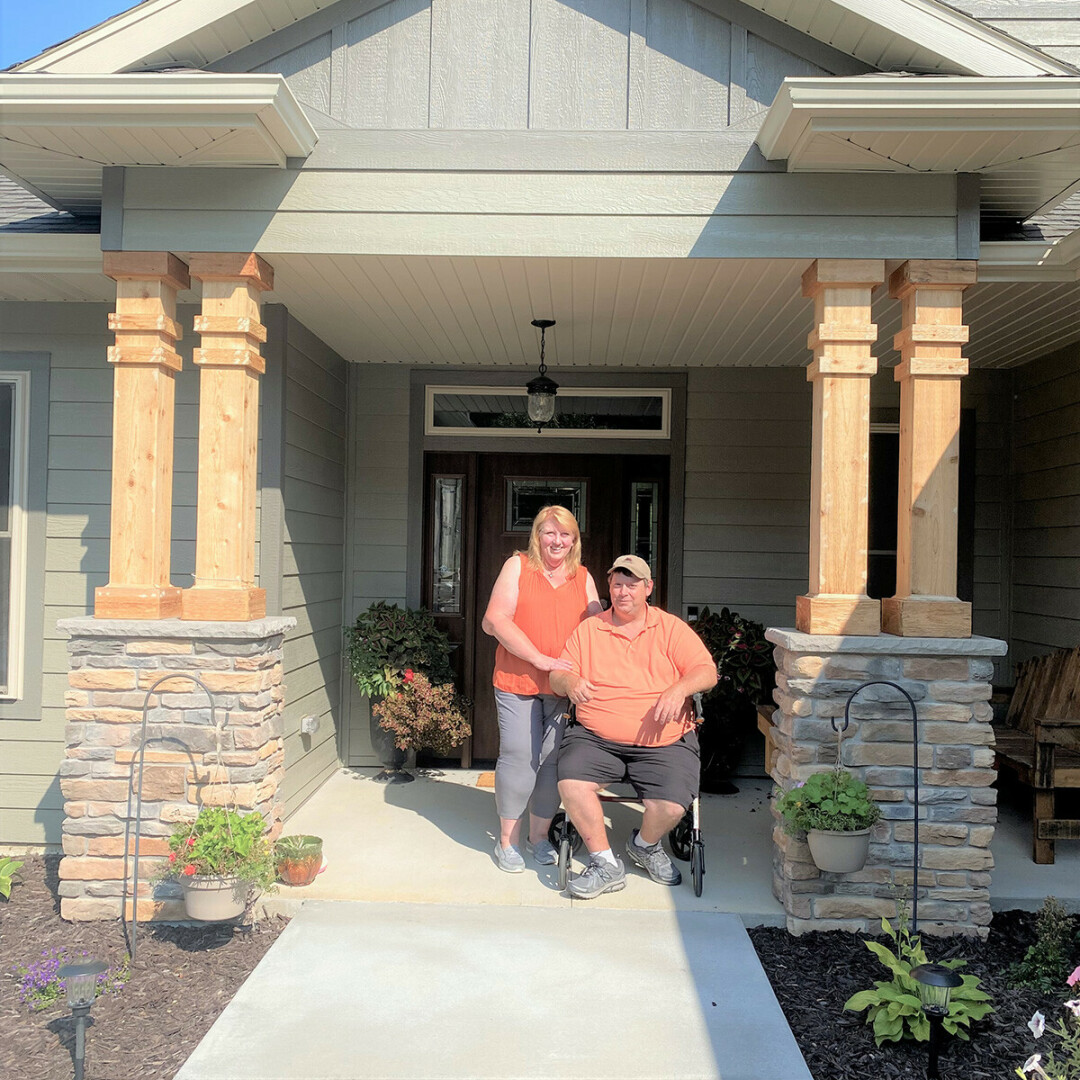 ABOVE: Karen and James Hauck of Eau Claire in front of their homes, which was designed with James’ mobility and safety in mind. 