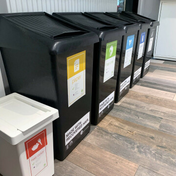 Green Circle distributes recycling bins, such as these, to its member salons. Some are made from bio-plastic that is made from recycled human hair. (Submitted photo)