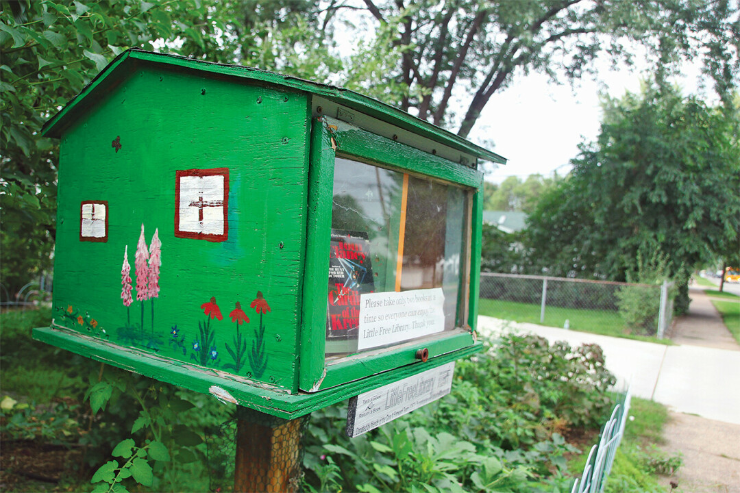 EXPLORE & READ! Weave throughout the E.C. Eastside Hill neighborhood's array of little free libraries, and you may even stumble upon a dragon!
