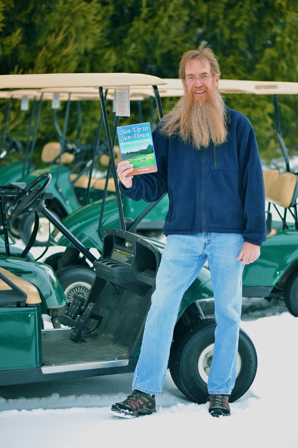 CAPTAIN OF THE GOLF CART ARMADA. Author and retired UW-Stout psychology professor Tom Franklin shows off his new book, Sun-Up to Sun-Down: The Lives of Golf Course Owners.