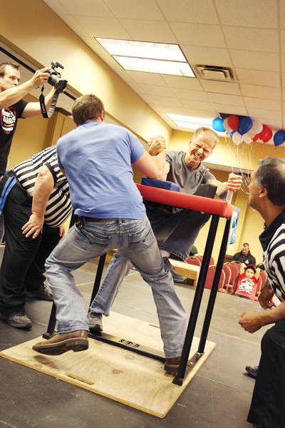 ONE REFEREE PER ARM. THAT’S HOW THEY ROLL. The 2013 USAF Unified National Armwrestling Championship took place at America’s Best Value Inn in Eau Claire, June 14–16.