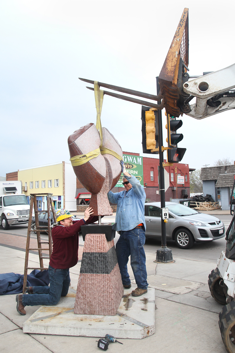 STONE COLD INSTALLATION. Sculpture Tour Eau Claire installed its fourth round of sculptures downtown on May 6 and 7. This hefty beauty can be seen on the corner of Madison and North Barstow Streets.