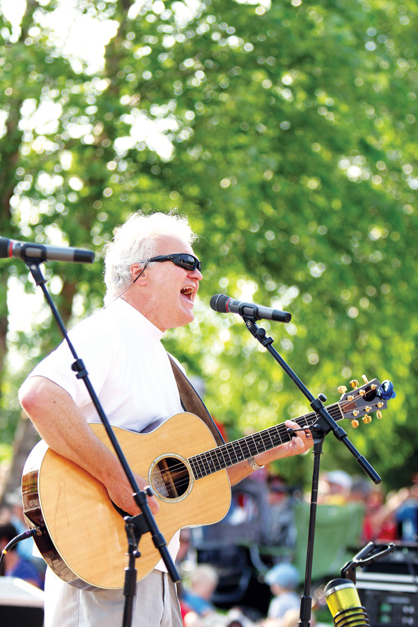DON’T LET THE ACOUSTIC GUITAR FOOL YOU. Yata Peinovich brought his new, rockier style to the Sounds Like Summer Concert Series in Phoenix Park on July 17.