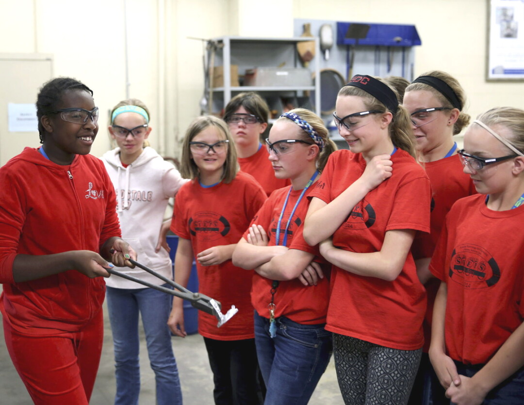 PARTICIPANTS IN THE 2014 UW-STOUT STEPS PROGRAM VISITED THE CAMPUS FOUNDRY. the summer program is for girls entering seventh grade.