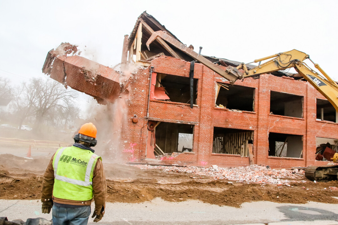 A demolition crew ripped down the Huebsch building on N. Dewey Street in downtown Eau Claire on November 29. The 20,000-square-foots brick building was building around 1907.