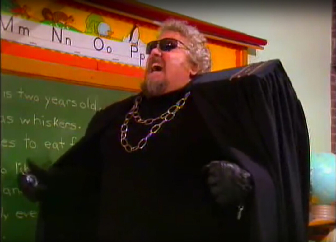 Larry Laird as the evil Storylord Thorzuul, a caped, sunglasses-rocking villain, shown here in anguish. Image: 