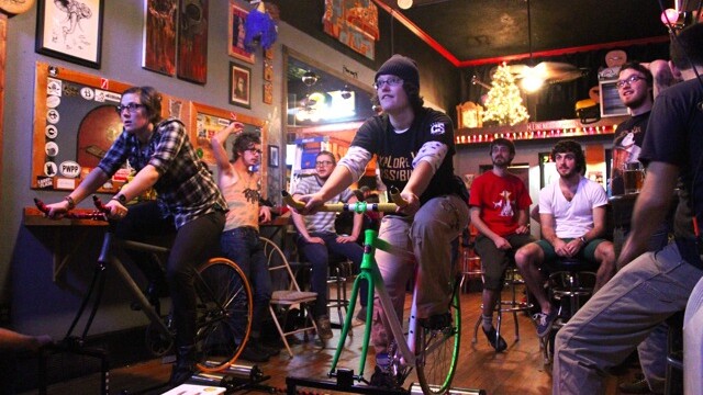 THE MOST FUN YOU CAN PROBABLY HAVE RIDING A BIKE INSIDE A BAR. Local biking fanatic Derek Parr built a Goldsprints setup which debuted on Dec. 1 at the Mousetrap.