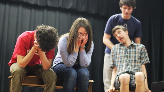 The Memorial High School Improv Team demonstrates its vast character range, from (left to right) “distraught man” to “distraught woman” to “guy standing behind chair” to “Stephen Hawking”. These (and other) chops helped to land them a spot at the Chicago Teen Comedy Festival on May 7.