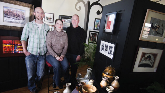 Now open: The Brent Douglas Artist Gallery at 224 North Dewey Street. Left to right: Owners Brent Stelzer and Nika Schwarz with Manager Dave Cramer.