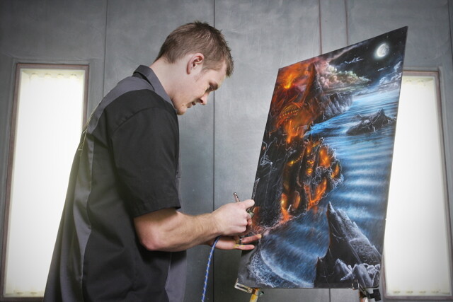 When he’s not painting cars, motorcycles, helmets, signs and more, 21-year-old local air brush artist Luke Johnson covers canvases with fantastic landscapes.