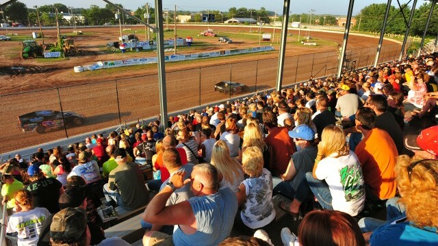 TURN LEFT! TURN LEFT! Hundreds of spectators fill the Red Cedar grandstand every Friday night.