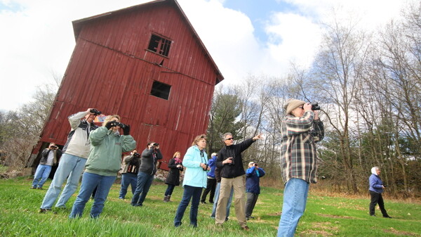 HOW TWEET IT IS. Birding guru Steve Betchkal (center), shown here leading a field trip earlier this spring, wants Eau Claire to pursue the Bird City designation.