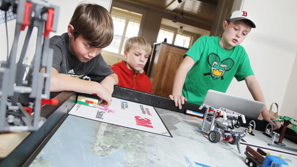 Members of the Eau Claire-based Lego robotics team The Brain Builders watch as their robot tries to grab and drag a truck. Later this month, the elementary-aged team will be competing against middle schoolers at this year’s state competition. They’ll be graded on the construction of their robot, as well as the character of their team.