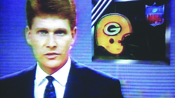 THIS JUST IN: MY HAIR IS PERFECT. Bob Brainerd appears in a WEAU-TV sports broadcast in 1990.