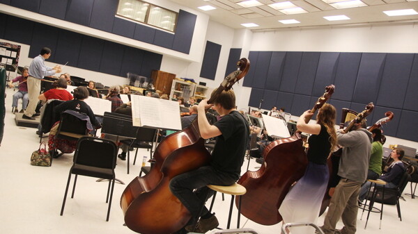 BACK TO BASS-ICS. Maestro Nobuyoshi Yasuda, far left, conducts the Chippewa Valley Symphony Orchestra at a recent rehearsal. Their final concert of the season in May 10.