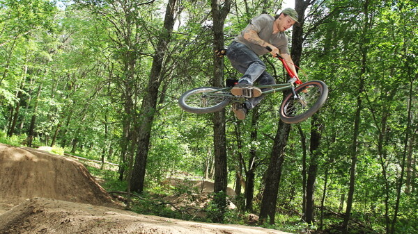 BREAK/HANG TIME. Cody Curry shreds a dirt ramp at Pinehurst Park in between stints of trail grooming.