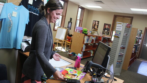CHECK IT OUT, FOLKS. Librarian Katie Johnson at work in the brand-new Elk Mound Library.