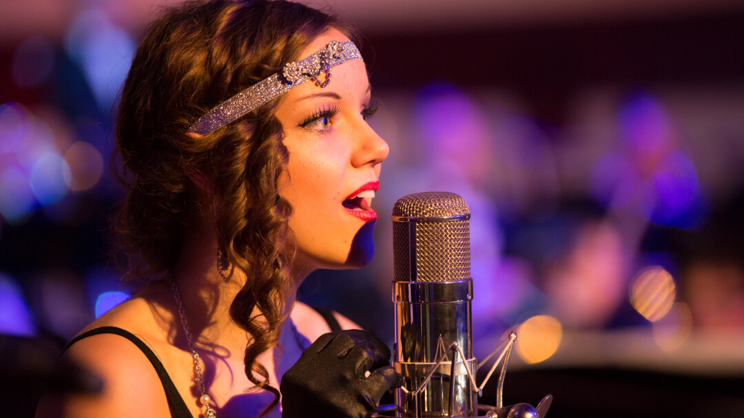 CROON TIME. Brooke Nicole Sjoquist was among the performers on Nov. 14 when Eau Claire Jazz Inc. (in partnership with UW-Eau Claire) presented Gatsby’s Gala at the Davies Center. The jazz age-themed dance took cues from The Great Gatsby’s portrayal of the Roaring Twenties.