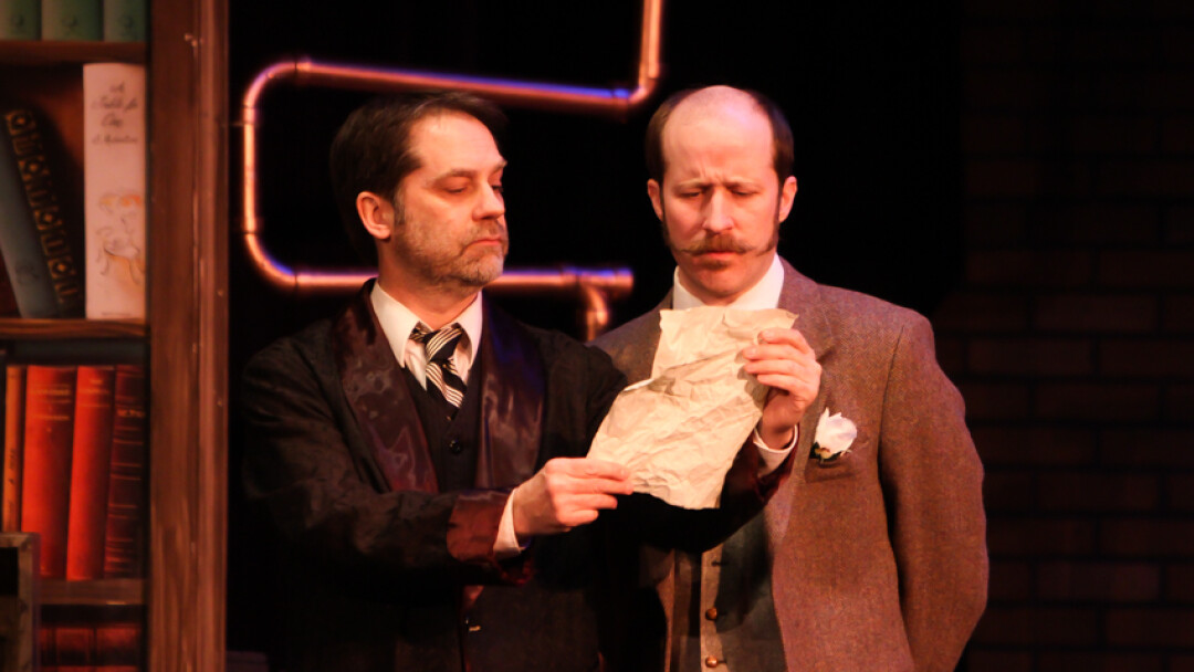 “SEE HERE, WATSON, YOU OWE ME £35 FOR THESE CALLS TO MANCHESTER.” James Finn (left, as Sherlock Holmes) and Ned Gannon (as Dr. Watson) star in the Chippewa Valley Theatre Guild’s production of Sherlock Holmes: The Final Adventure, which runs through Feb. 22 at The Grand Theatre.