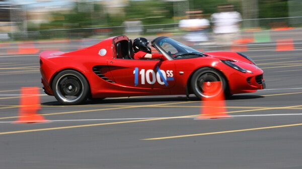 ZIP THROUGH THE CONES: Autocross puts sports car fans behind the wheel on a tricky parking lot obstacle course. 