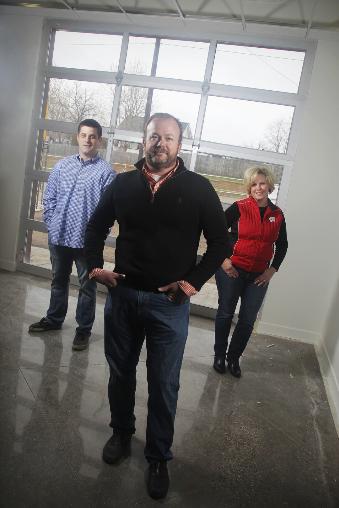 A DOORWAY TO FLAVOR. The team behind The Classic Garage is, from left to right, Alex Karrer (co-owner/general manager), Rick Payton (co-owner), and Kristi Kimble (operations manager).