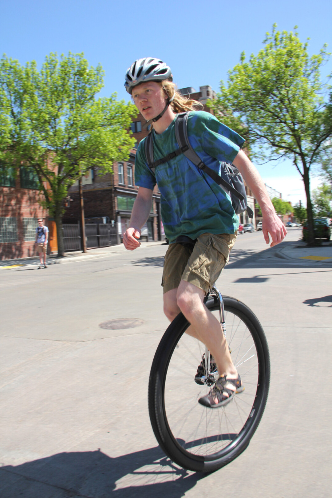 Spotted in Eau Claire: uni-versal access. Seen roaring down Eau Claire’s Graham Avenue on a sunny day in May, this unicycle commuter keeps it safe with the proper headgear.  