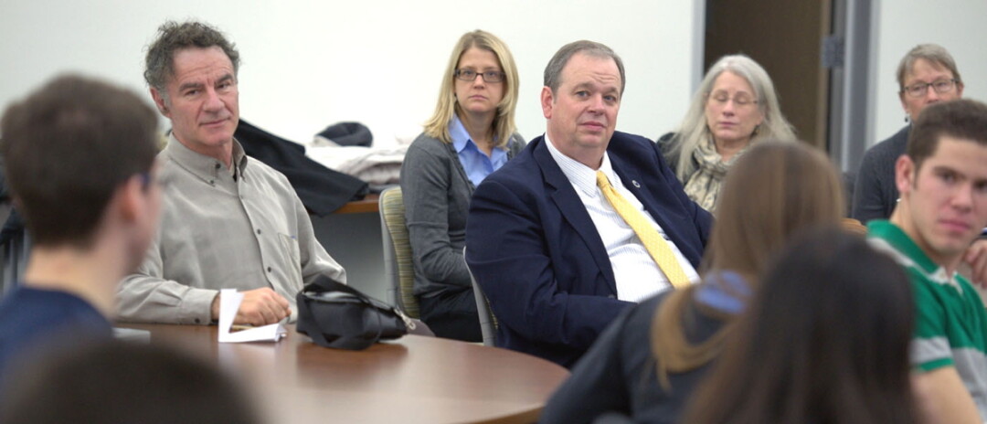 UW-Eau Claire Chancellor James Schmidt, center, listens during a faculty forum earlier this year.